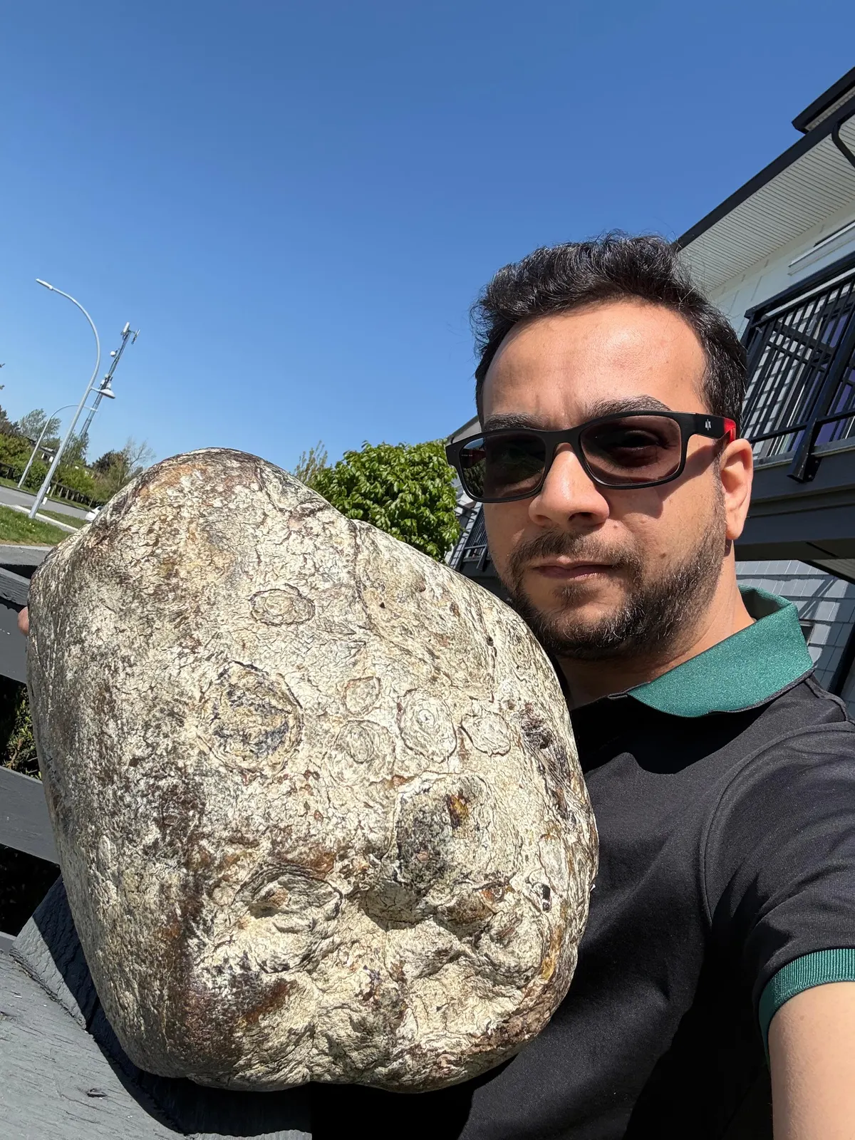 Large White Ambergris Specimen Held by Expert
