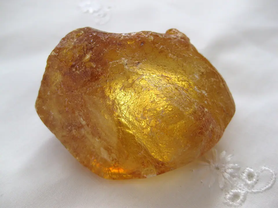A lump of unpolished kauri gum, a golden tree resin