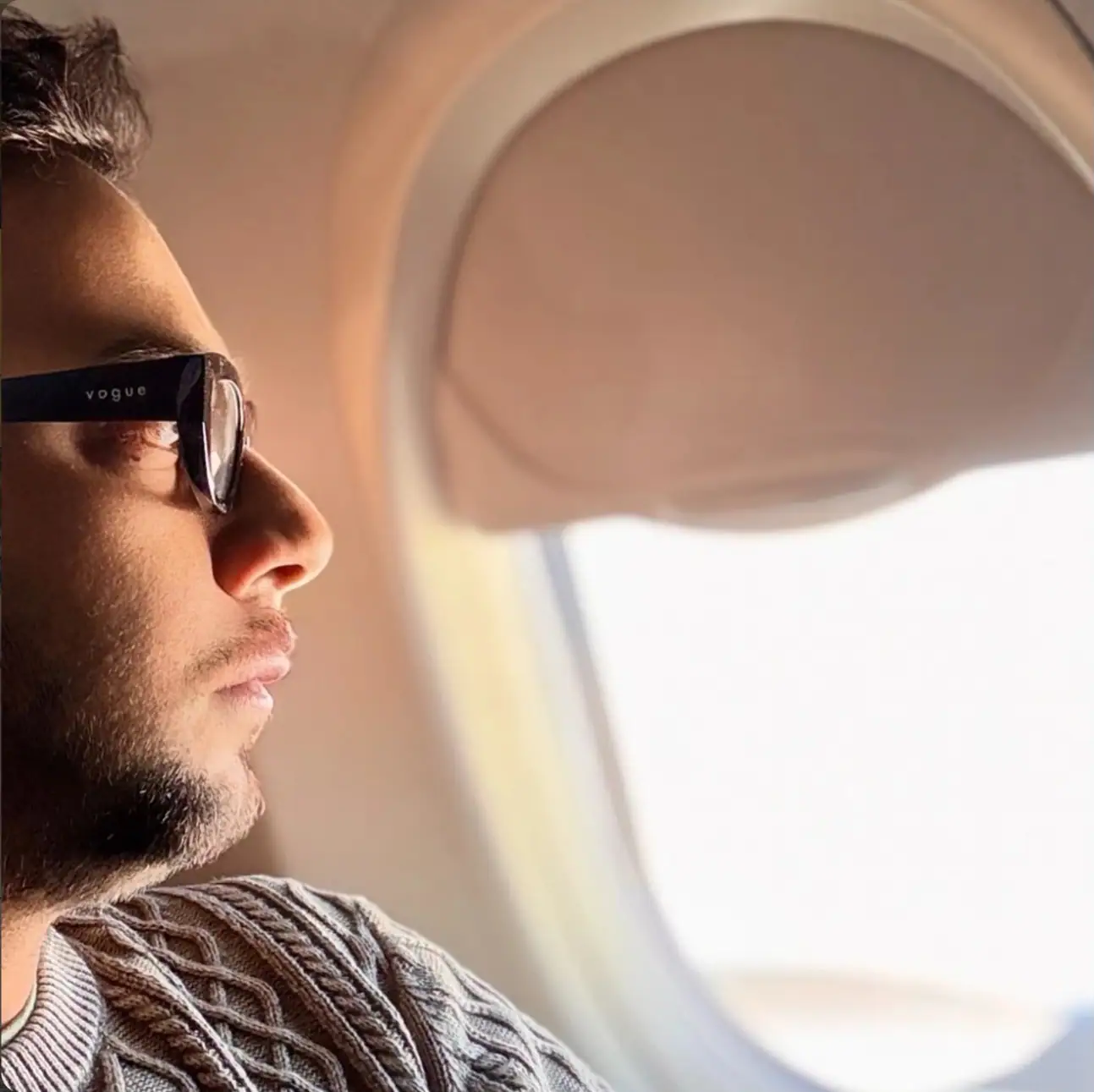 Nabil Valiulla looking out of an aeroplane window