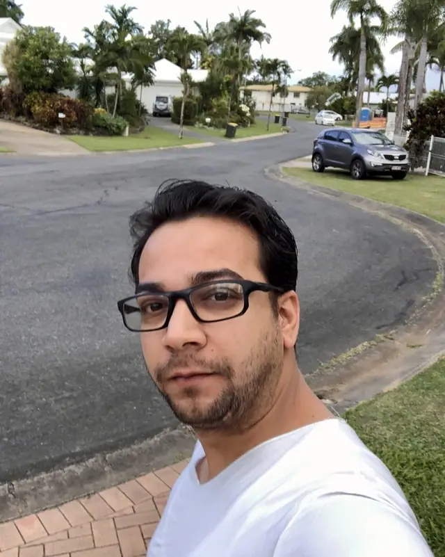Nabil Valiulla on a palm-lined street